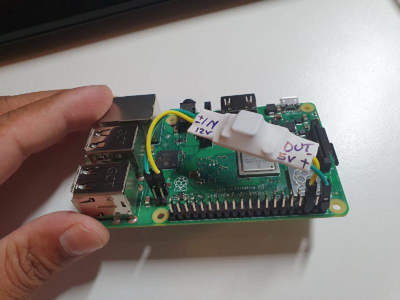 Buck converter in heatshrink connected to Raspberry Pi